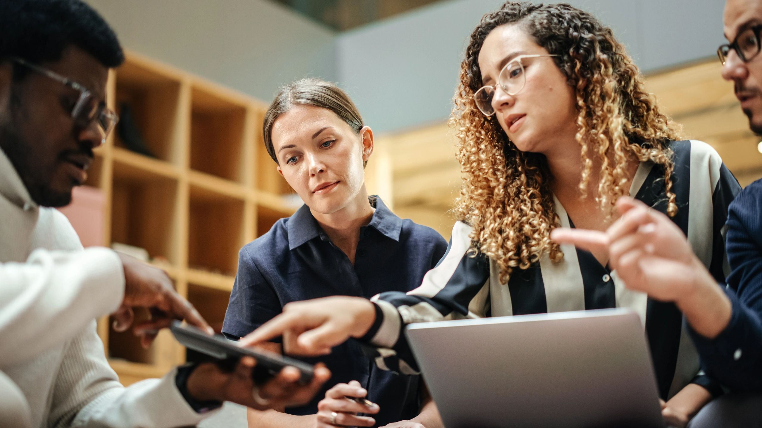 Diverse team collaborating in a modern meeting room